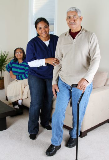 Home health care worker and an elderly couple